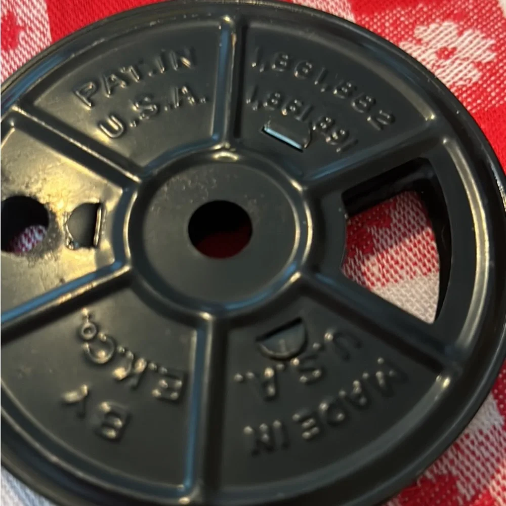 Vintage tin movie reel container with lock